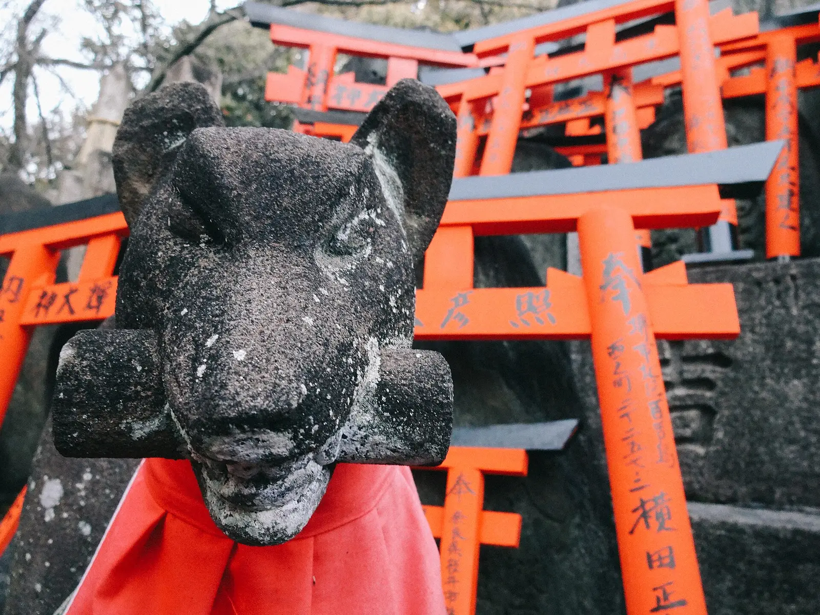A stone fox statue at Fushimi Inari Taisha