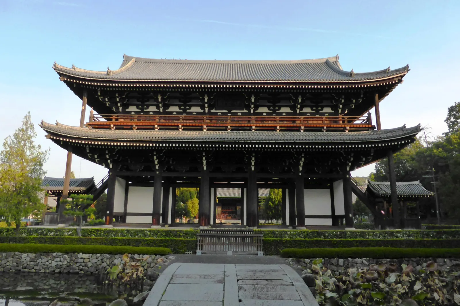 The two-story Sanmon gate at Tofuku-ji, seen from a stone bridge over the pond