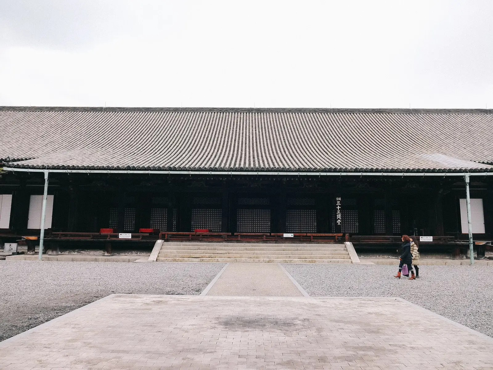 The long wooden hall of Sanjusangendo in Kyoto on a gray day