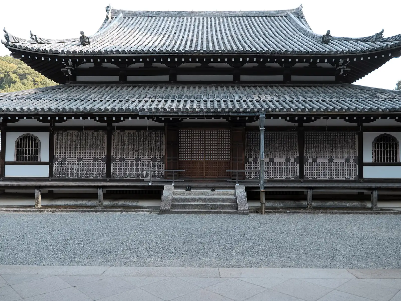 A temple building with a tiled roof at Sennyu-ji in Kyoto