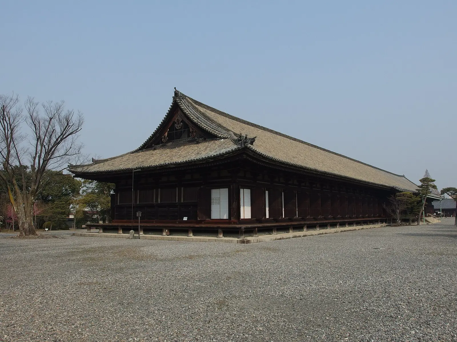 The south end of the Sanjusangendo main hall with its curved tile roof