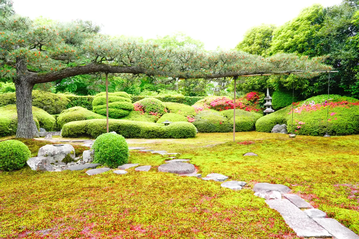 Moss garden and temple building at a Zen temple in Kyoto