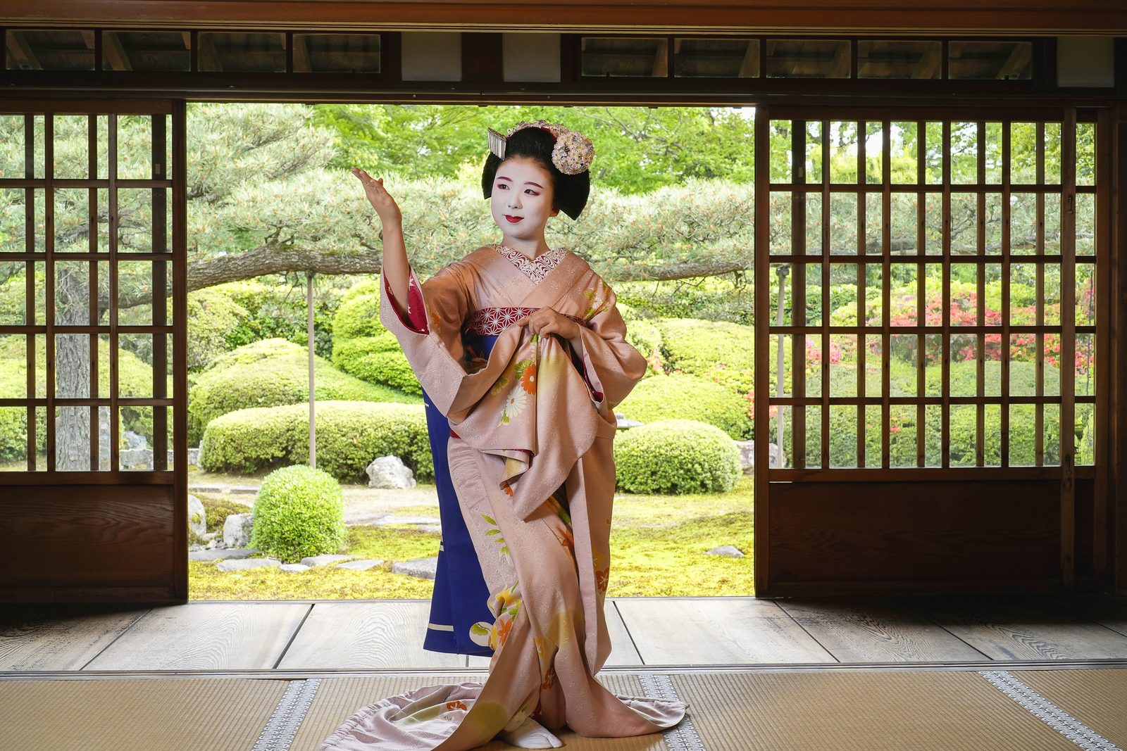 A maiko dancing in a private temple hall