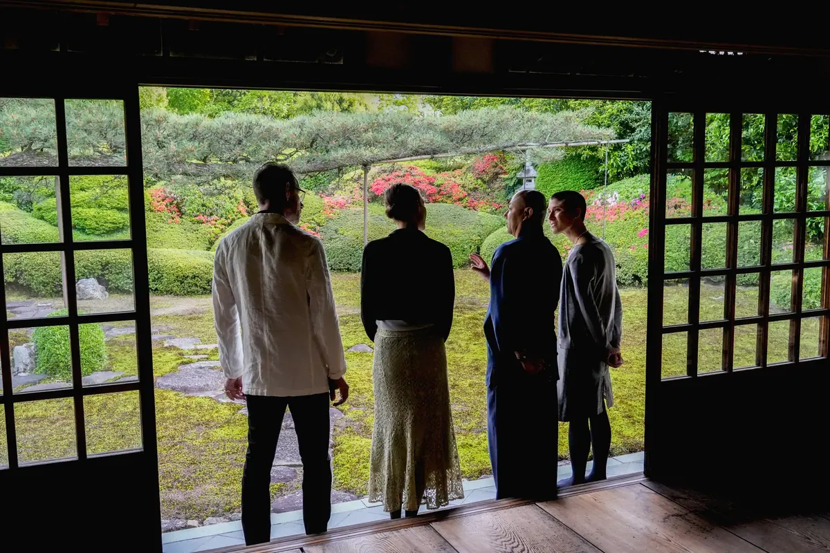 Guests taking in the moss and azalea garden from the temple hall
